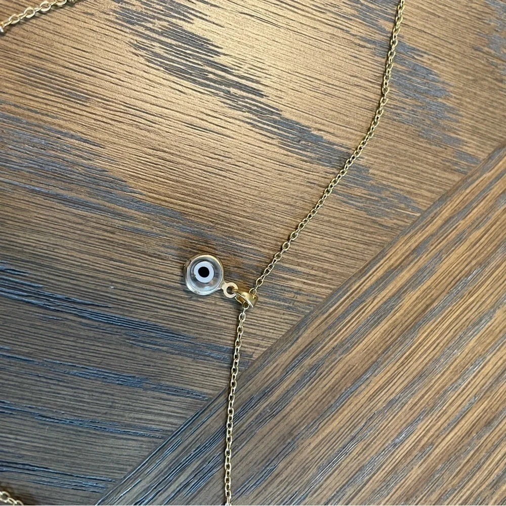 Evil eye pendant and orange pendant double layered chain necklace